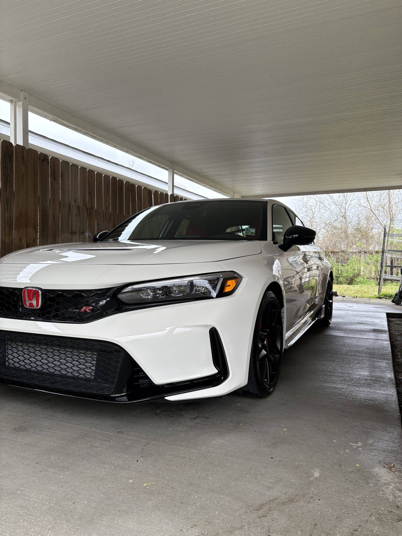 White Honda Civic Type R detailed by Bergeron's Detailing, parked under a carport with a clean, glossy finish