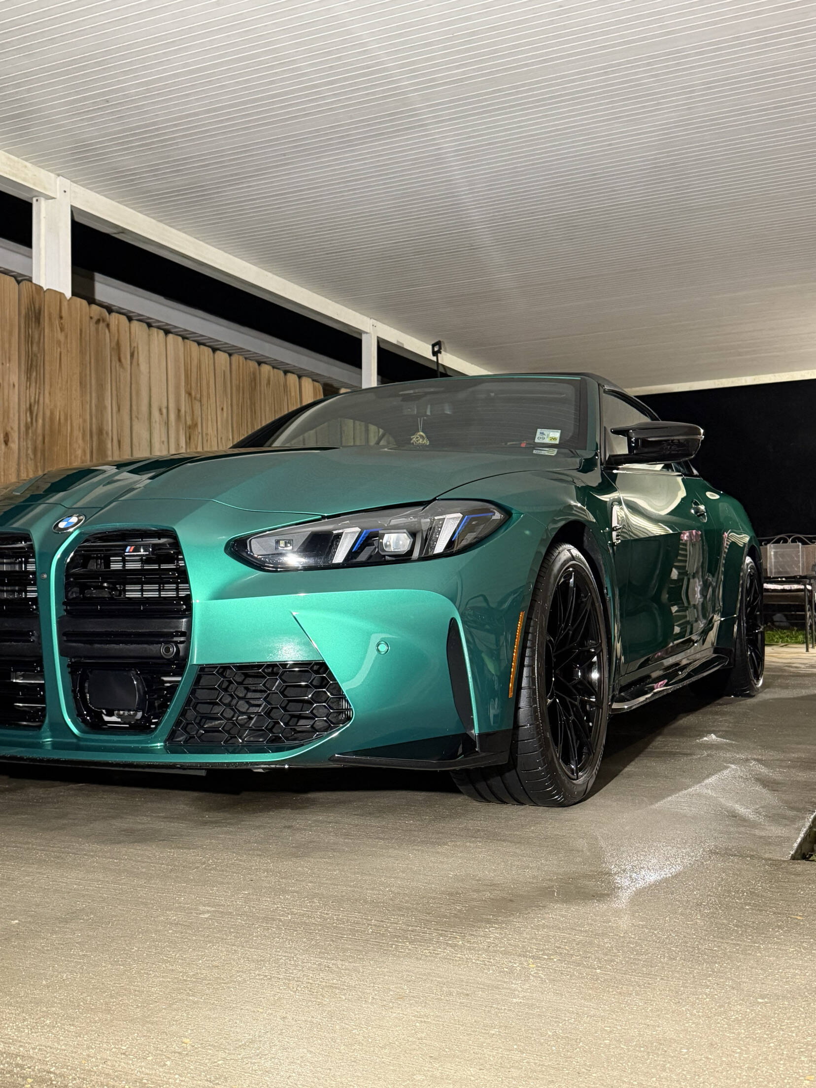 Green BMW M4 with a deep, clean exterior finish after detailing by Bergeron's Detailing
